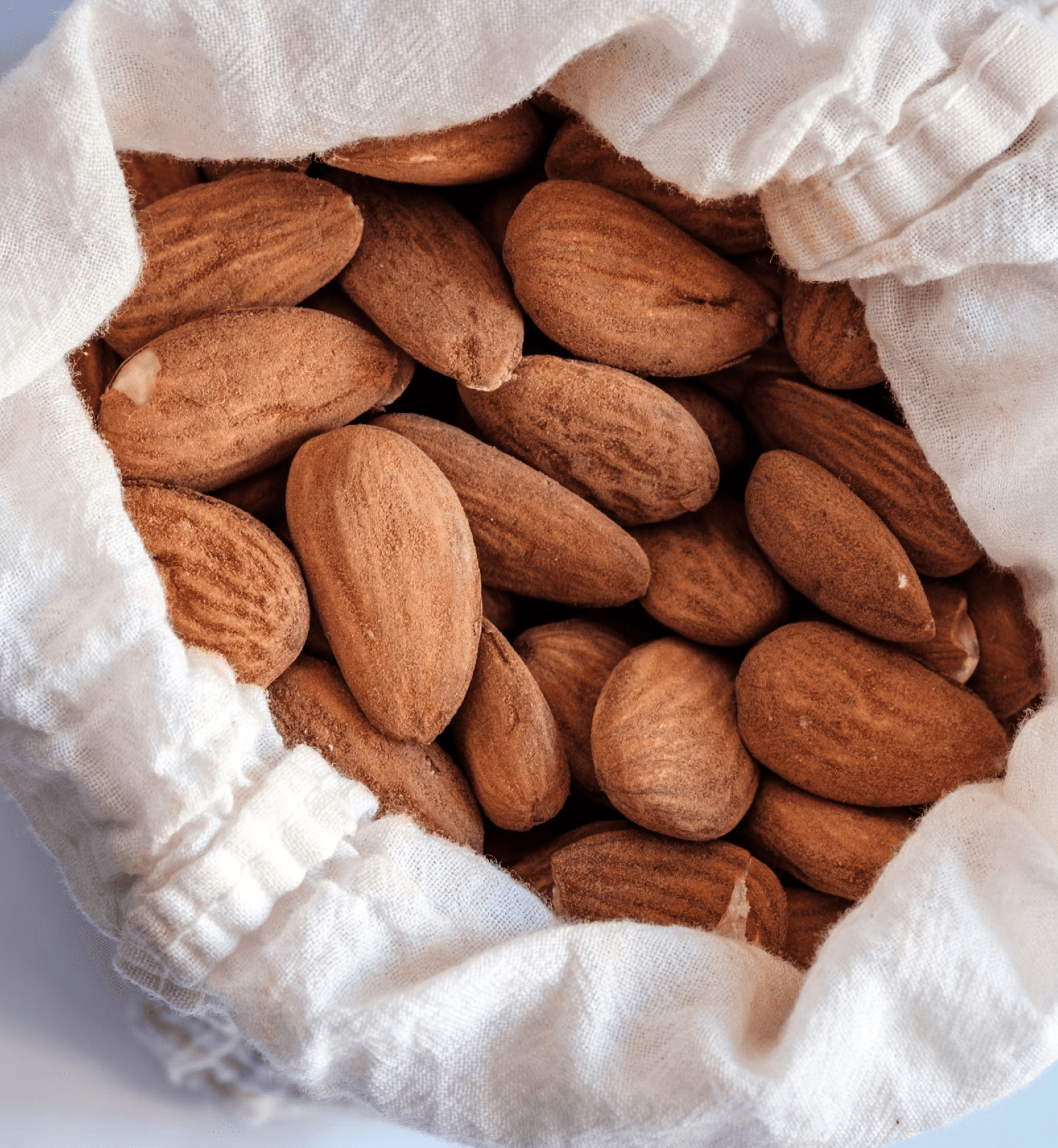 A burlap sack of almonds.